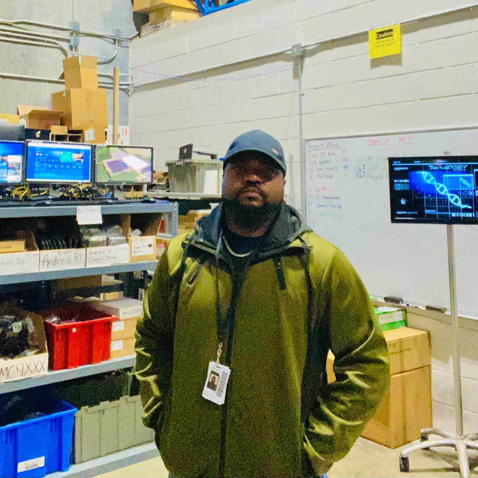 Organized IT equipment cage with labeled storage and professional layout