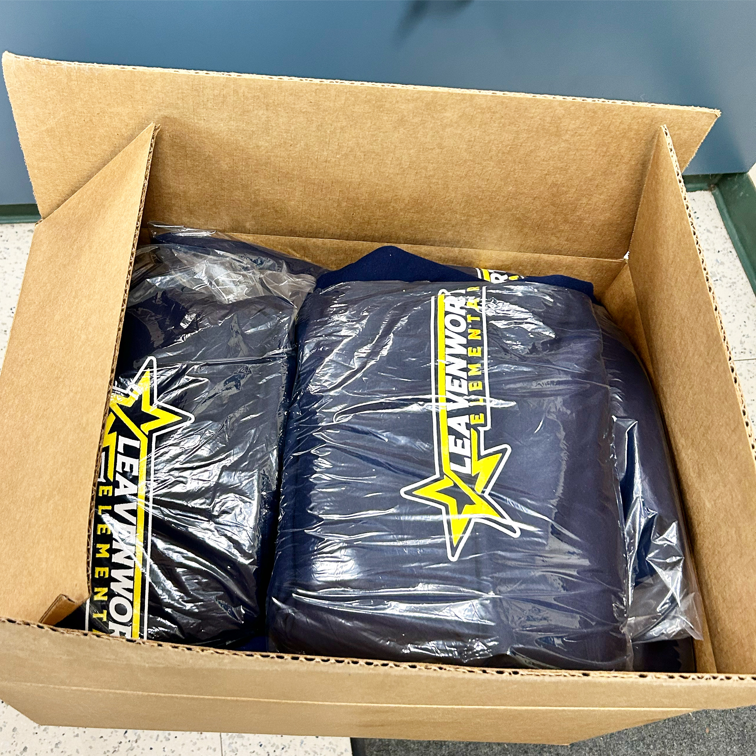 Boxed school hoodies ready for shipping and delivery