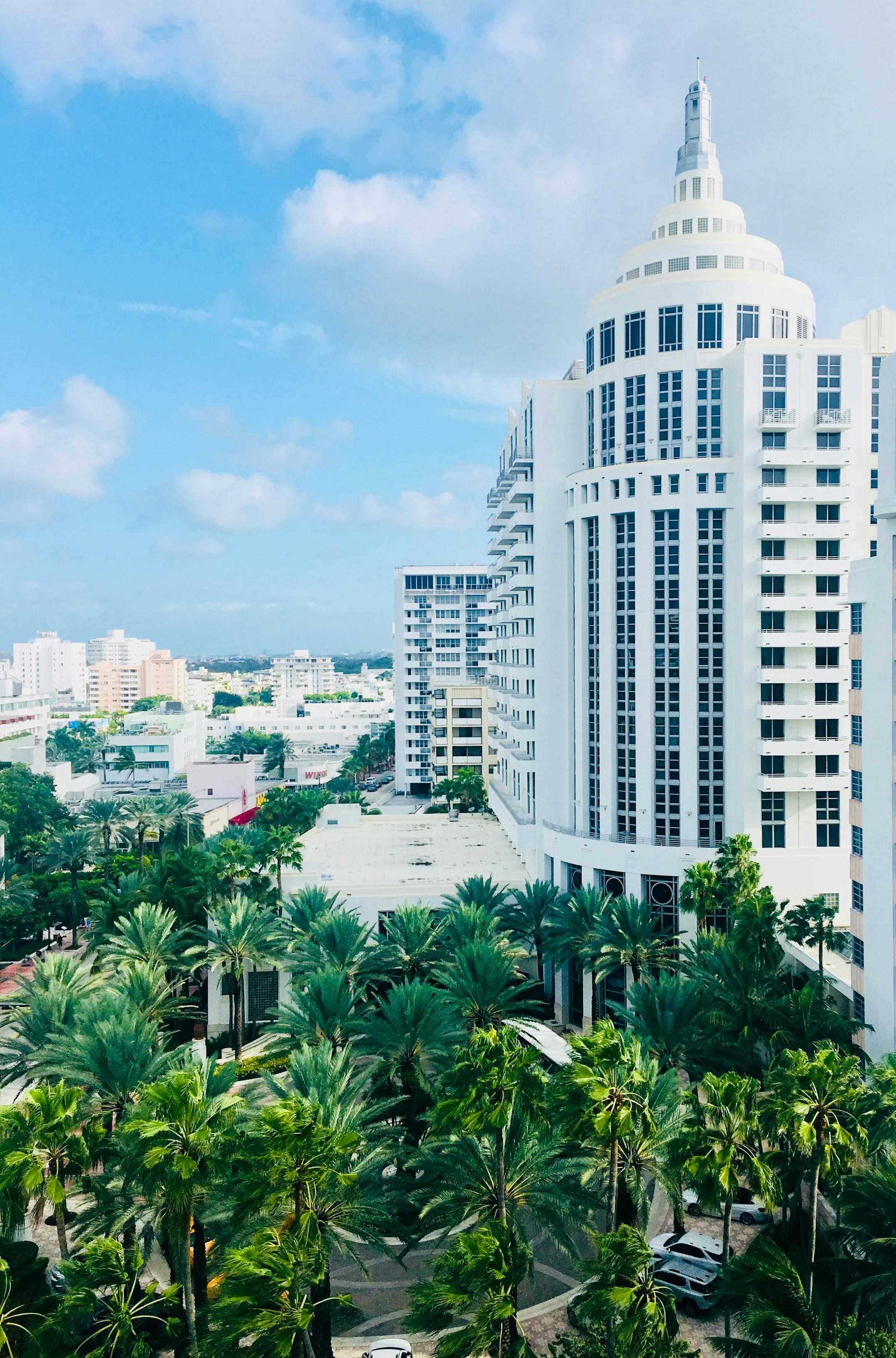 Elevated view of Miami Beach showcasing iconic architecture and palm trees.