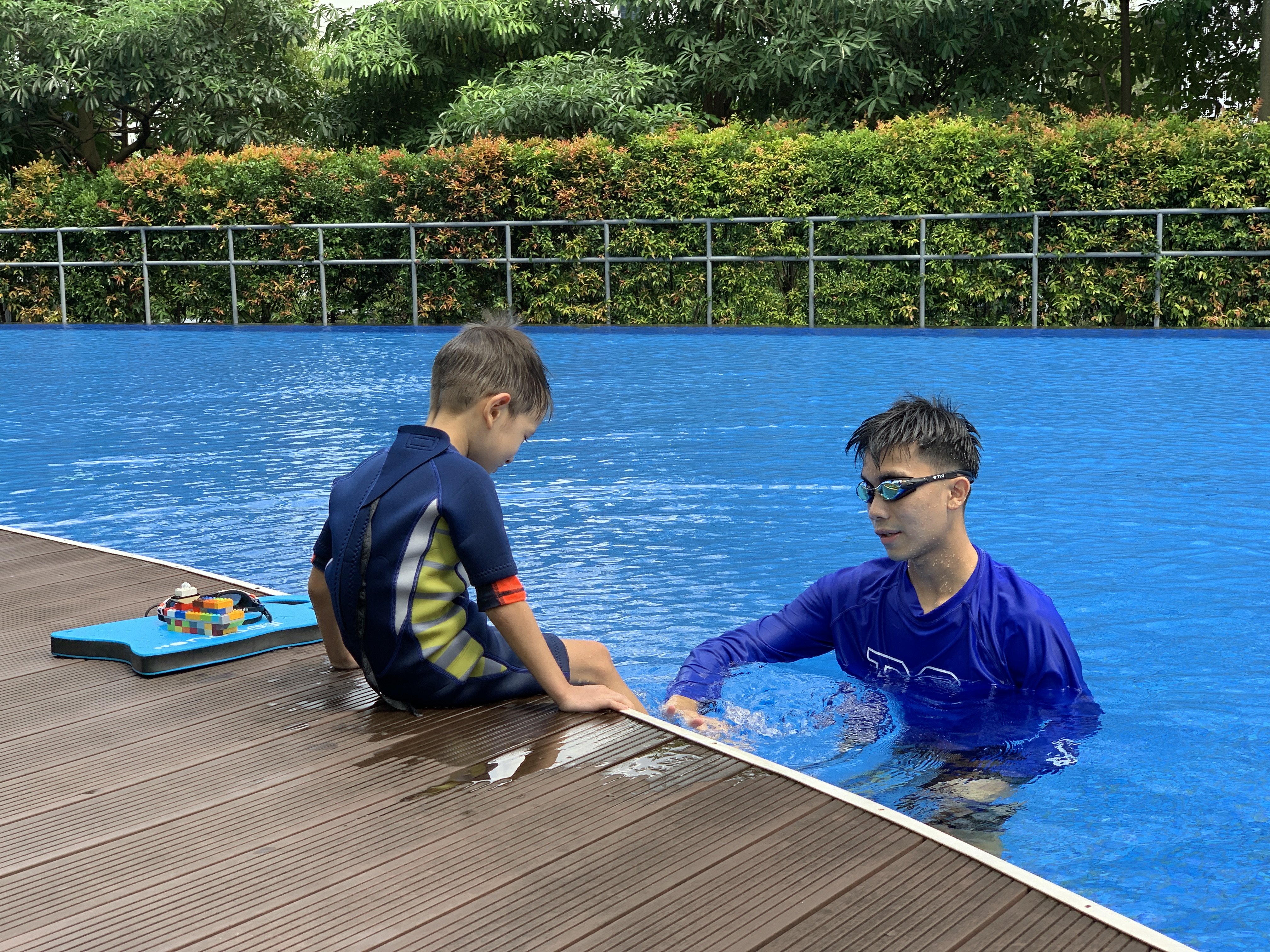 Swimming pool with kids and adults learning