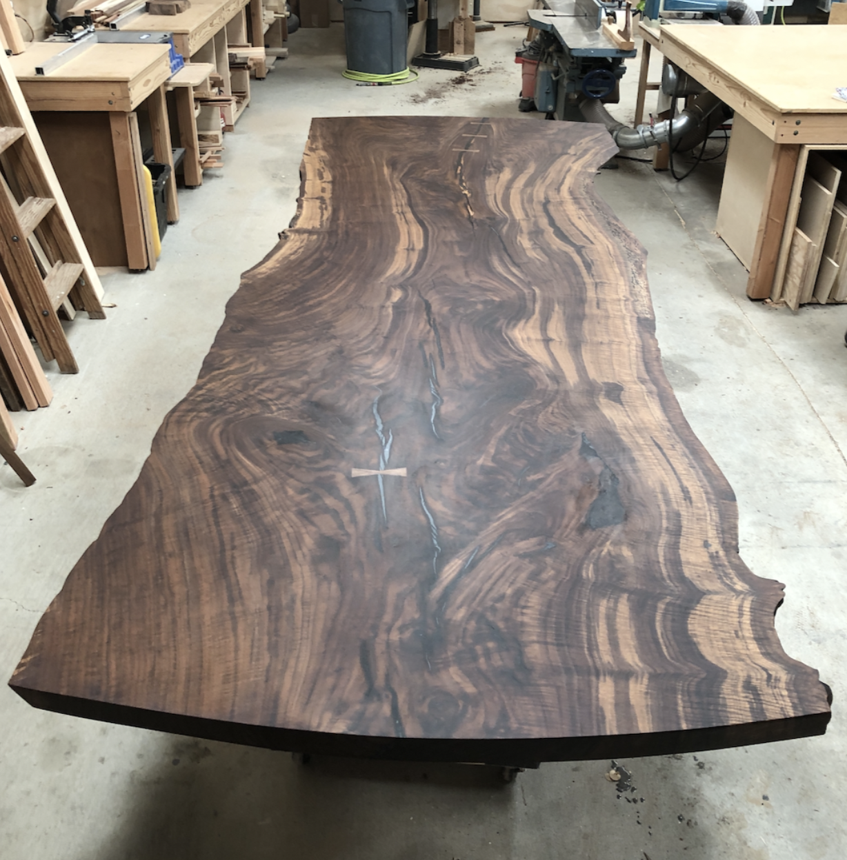 Claro Walnut slab dining table