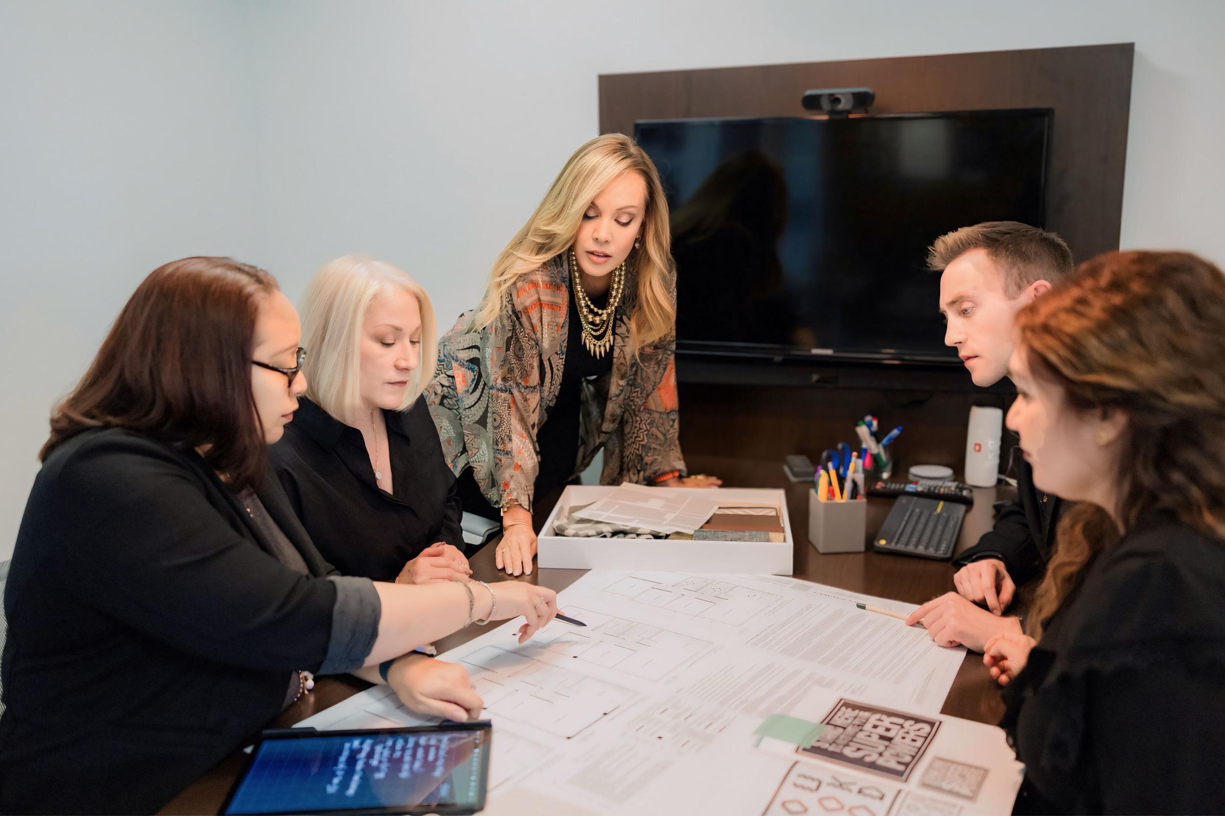 team looks at plans.jpeg