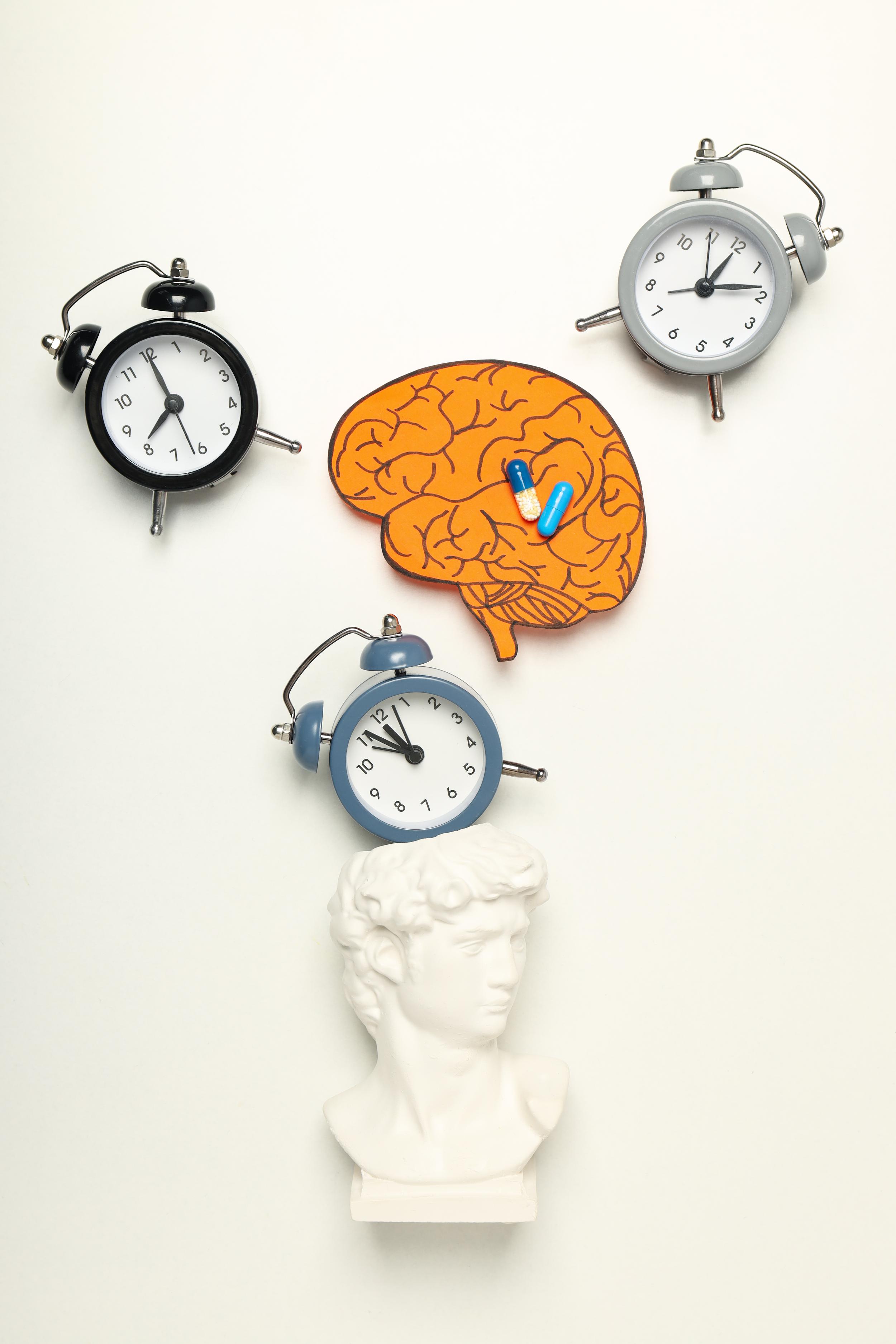Clocks and pills representing dementia