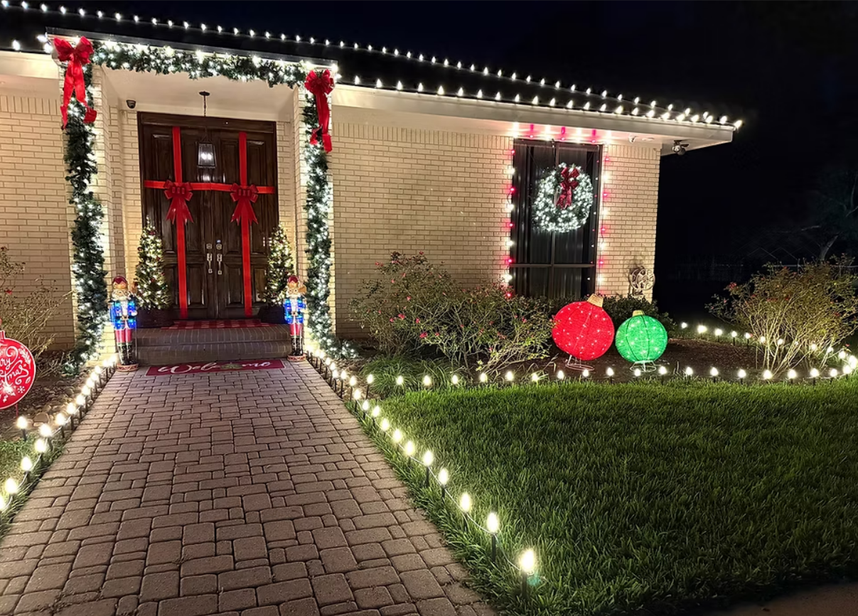 Southwest home with warm white Christmas lights along the roofline