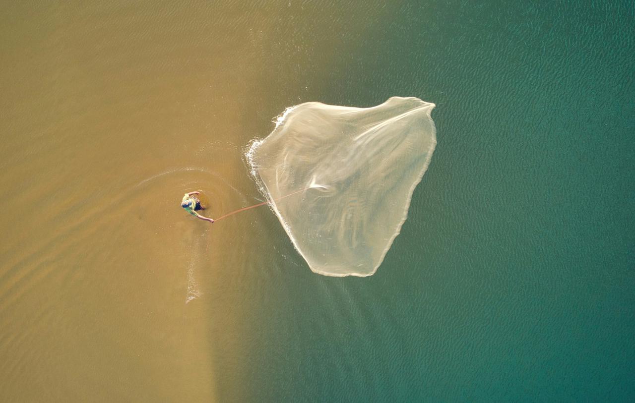 Man Throwing A Fishing Net