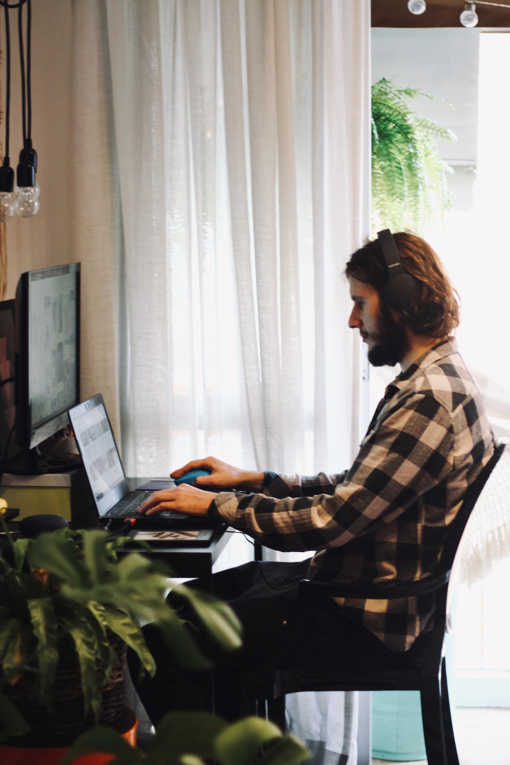 Photo of a man working from home and making money selling promotional products.