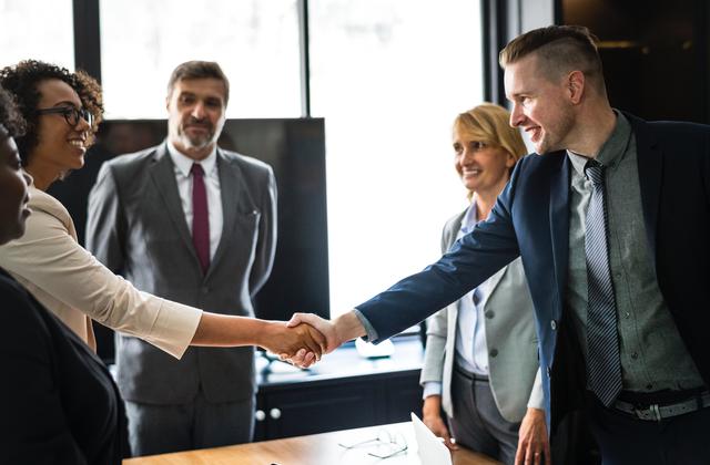 A handshake at the end of beginning of a business meeting, symobolizing helping to find jobs for people with disabilities