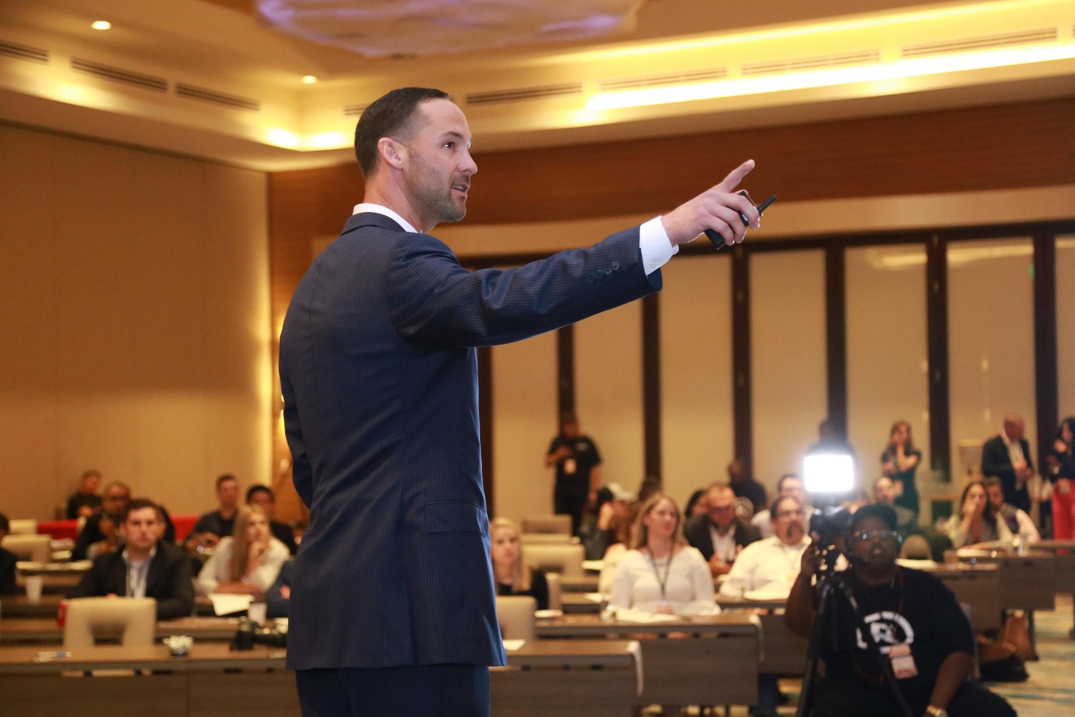 San Antonio Web Design - Jeremy McGilvrey on stage, presenting solutions for business owners. DISCLAIMER: These photos cannot be used in any inappropriate, defamatory, or copyright-violating manner. To inquire about our services, visit: https://www.jeremymcgilvrey.com.