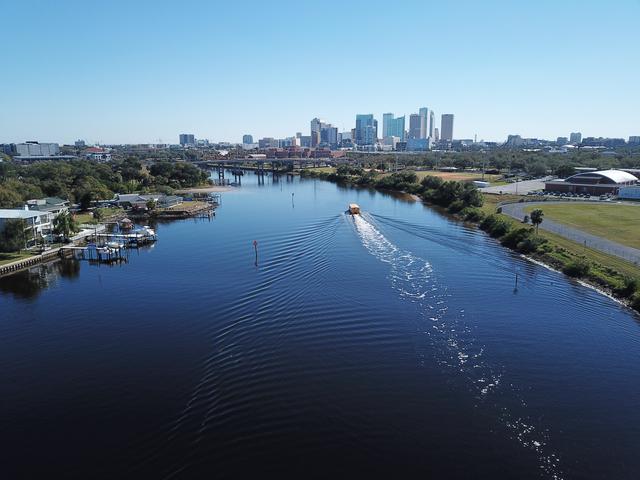 Aerial Drone Photography of downtown Tampa, Florida, and the water taxi on the Hillsborough river by Anita Denunzio.