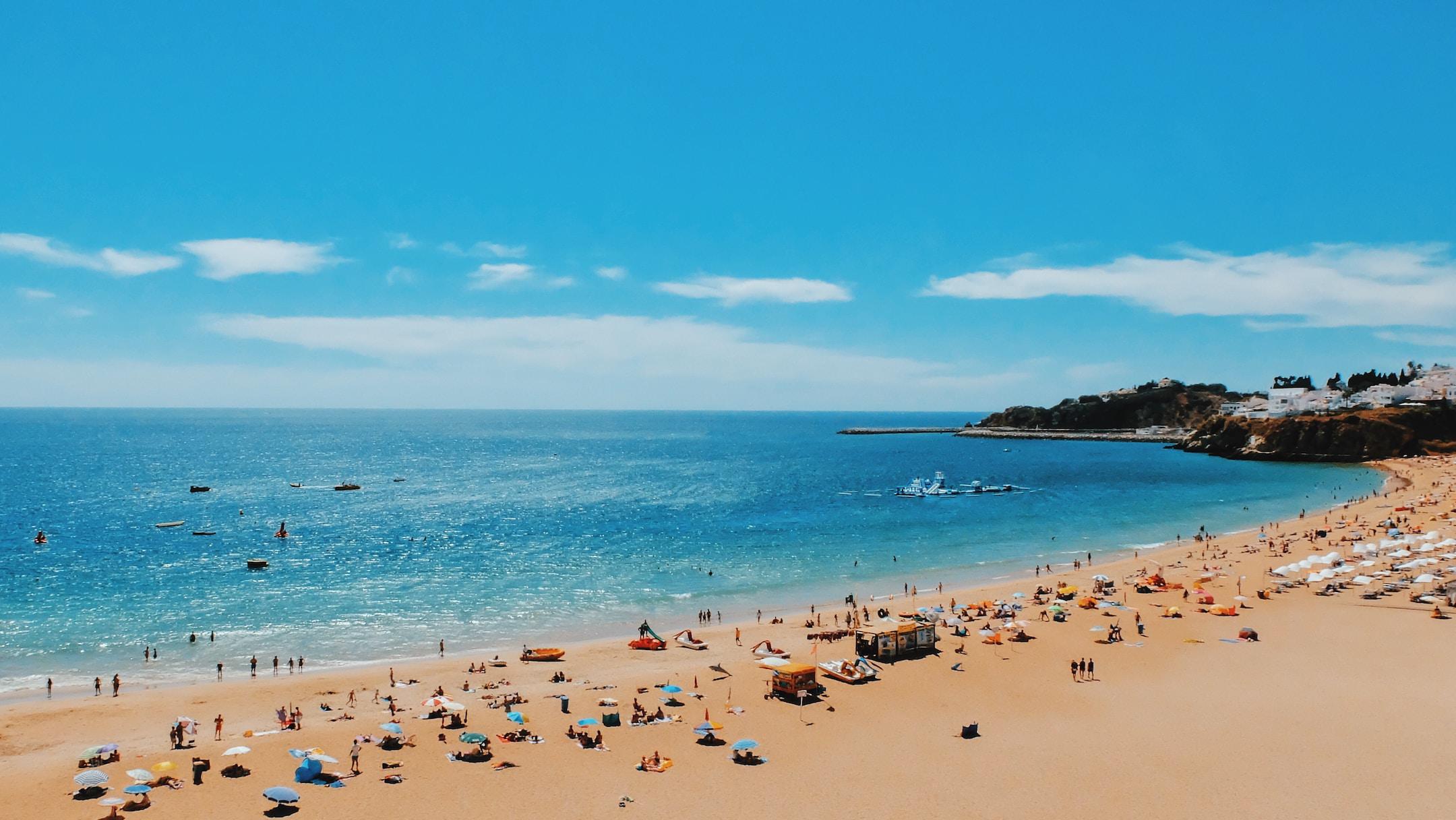 Tourists on a sandy shore