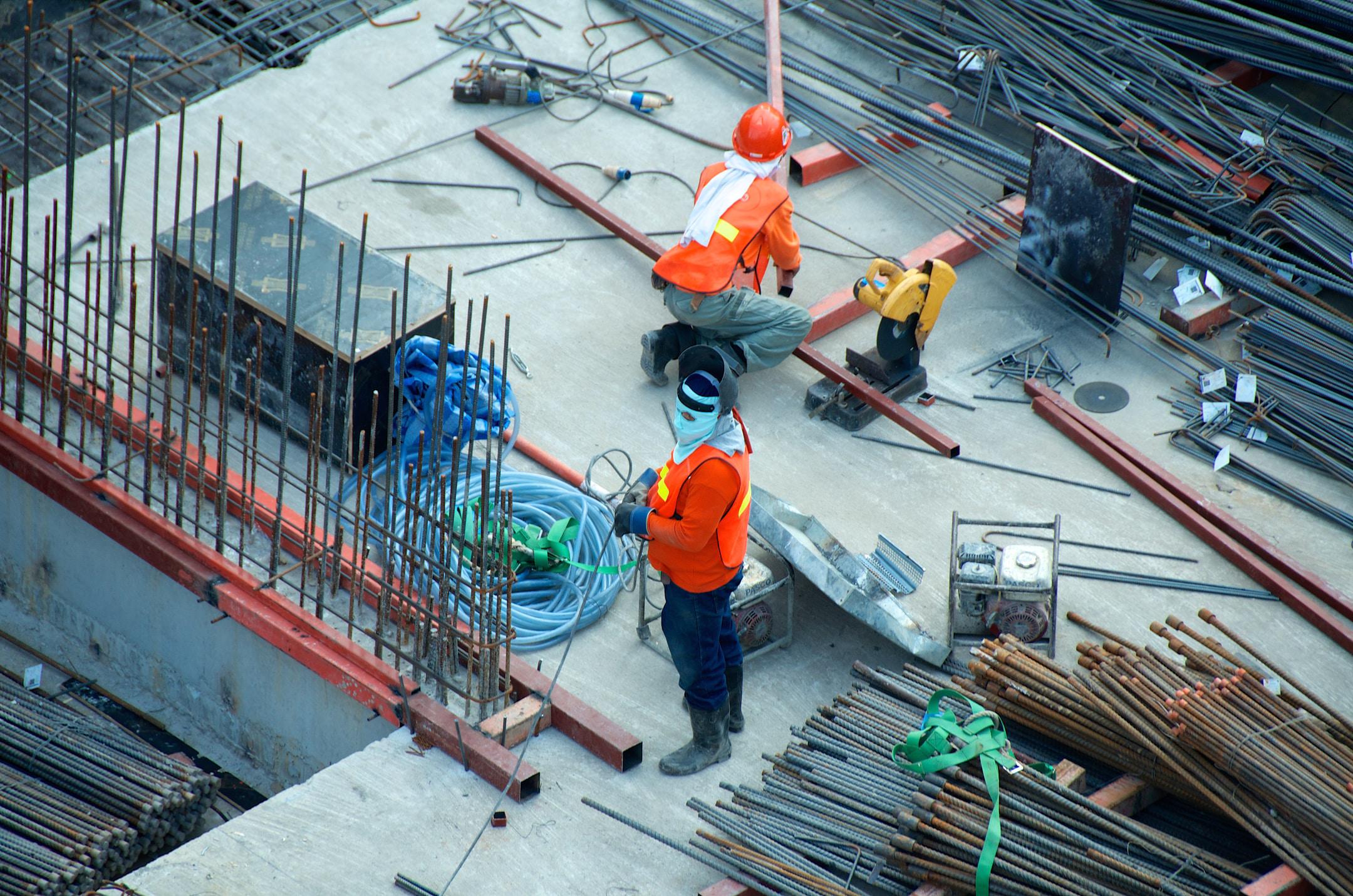 Concrete workers on a construction site.