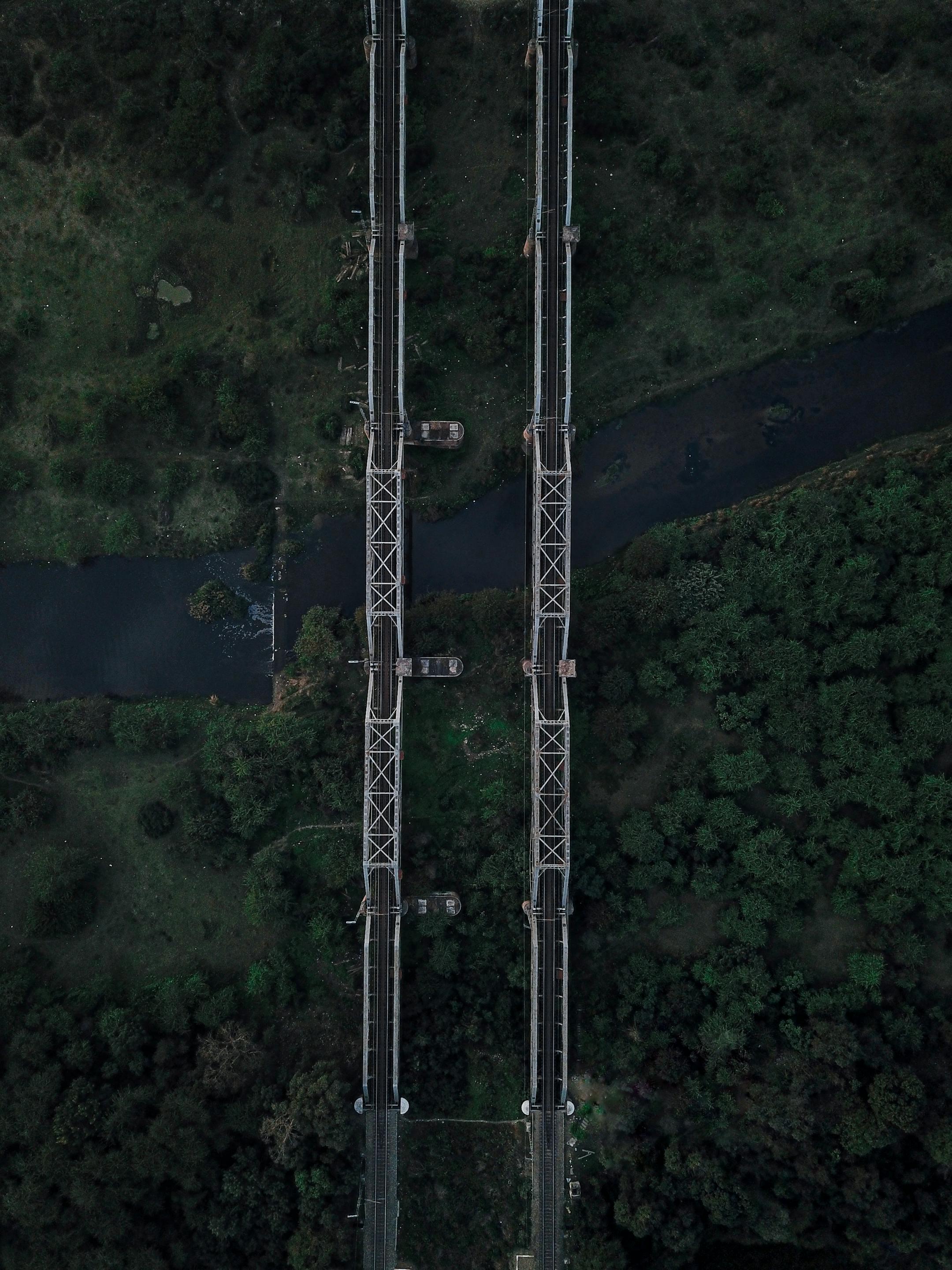 Drone shot of a bridge spanning a lush landscape in Kapurthala, India.