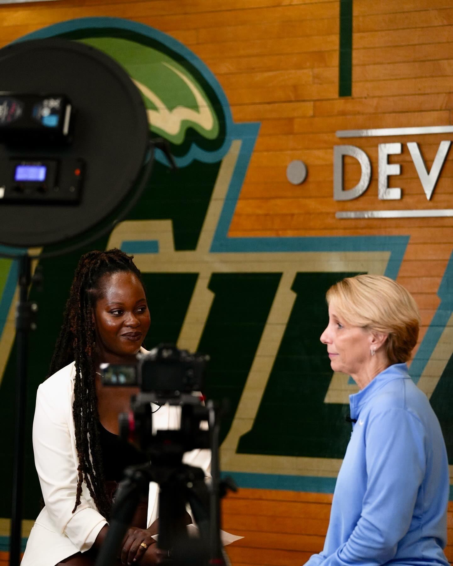 Tiffany Aidoo doing a media interview with a leader.