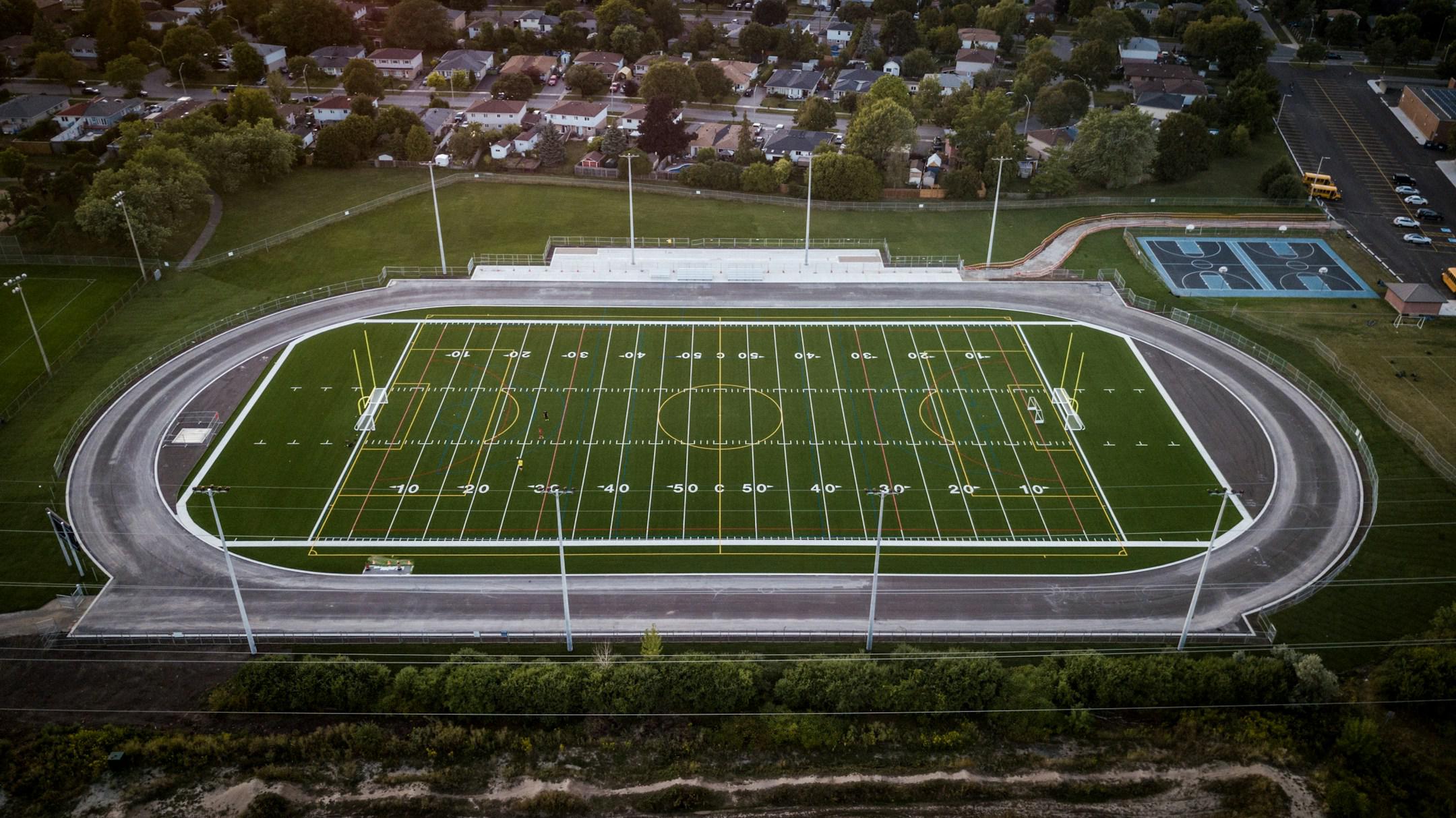 Football field with soccer nets and track.