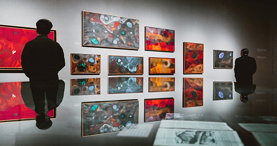 Visitors exploring a contemporary art collection in a gallery
