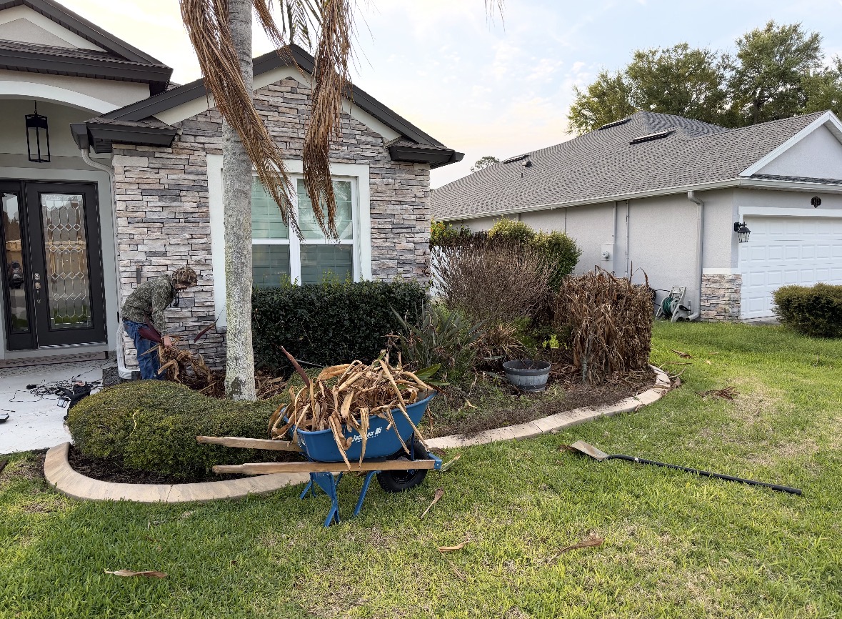 Professional landscapers working on a residential property