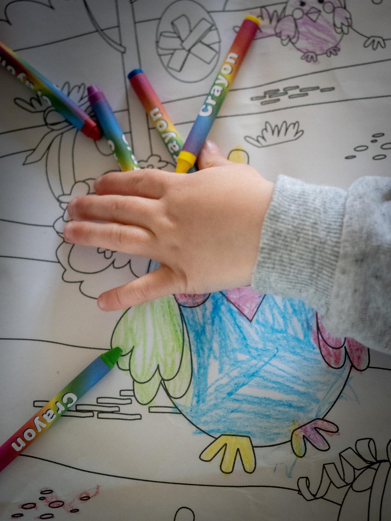 My boy playing with crayons. 