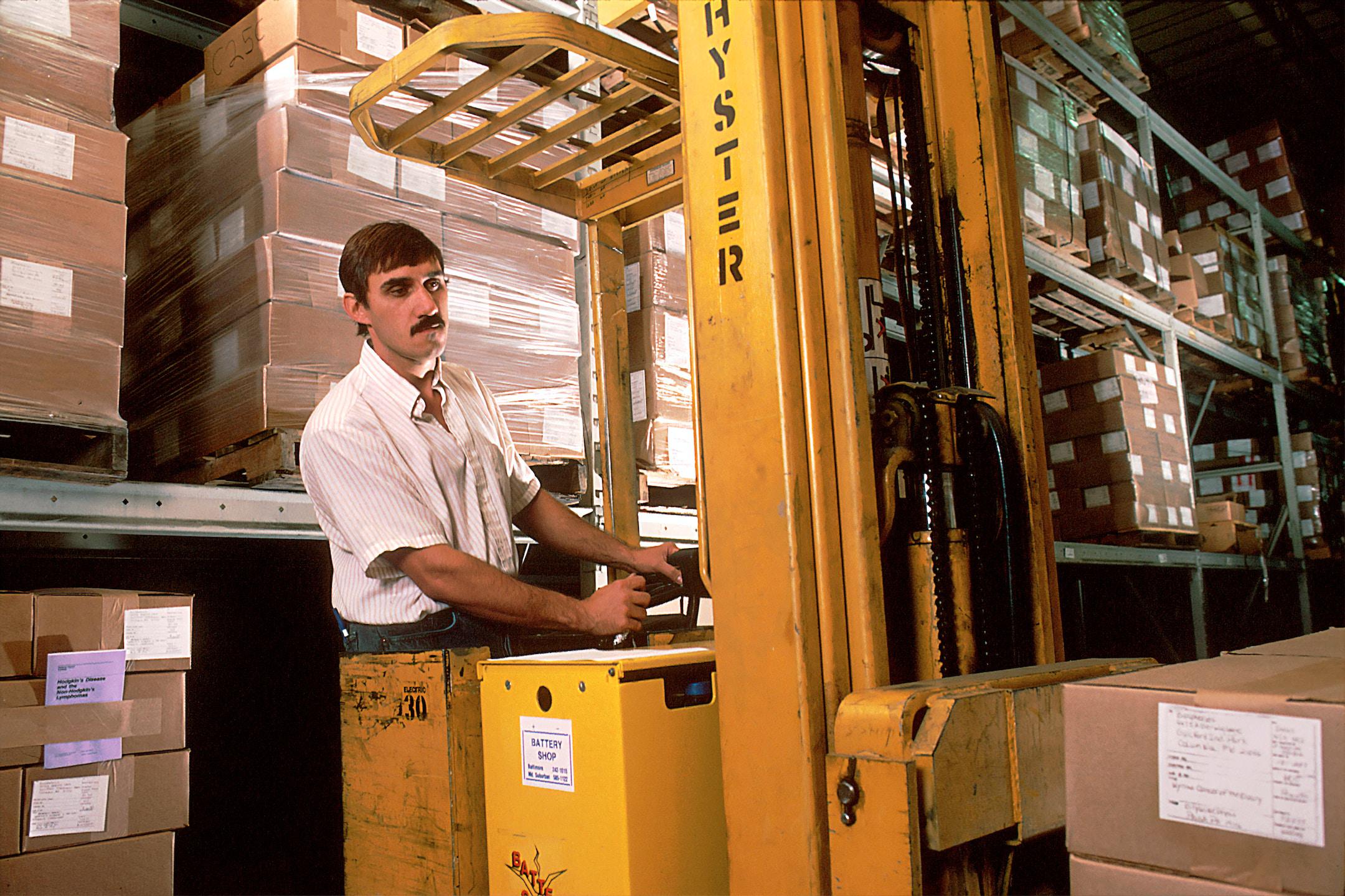 Image of someone driving a forktruck, who found work using a warehouse temp services agency.