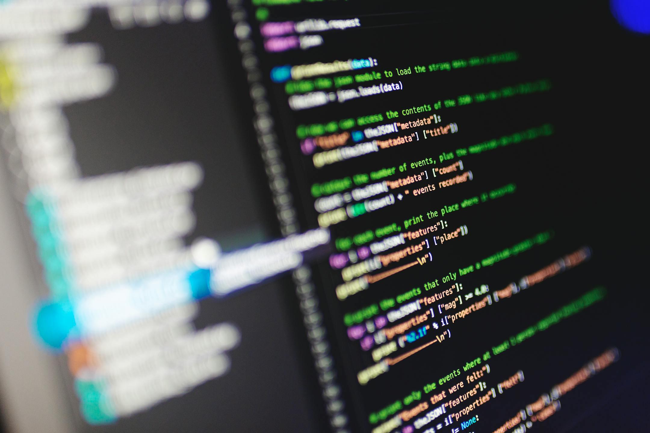 Close-up of a computer screen displaying colorful programming code in JavaScript.