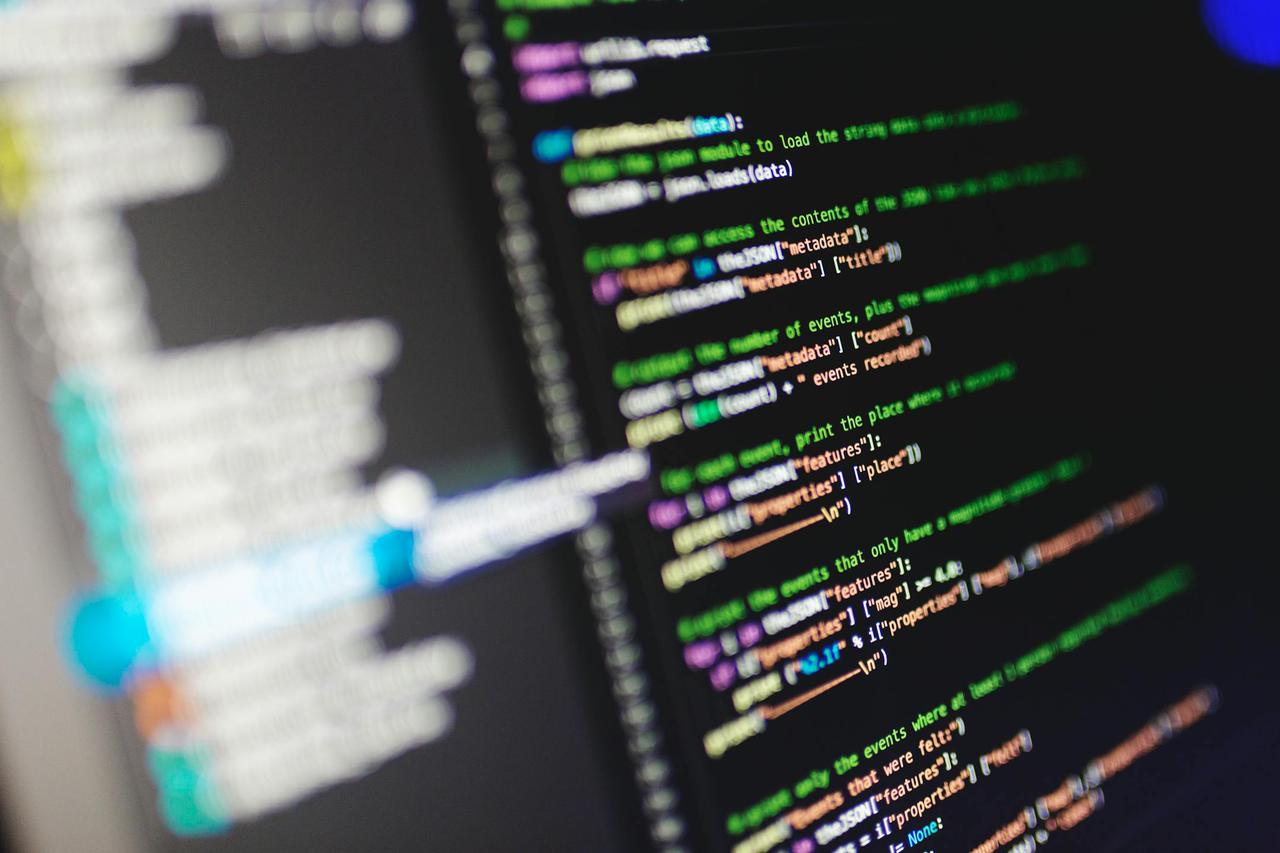 Close-up of a computer screen displaying colorful programming code in JavaScript.