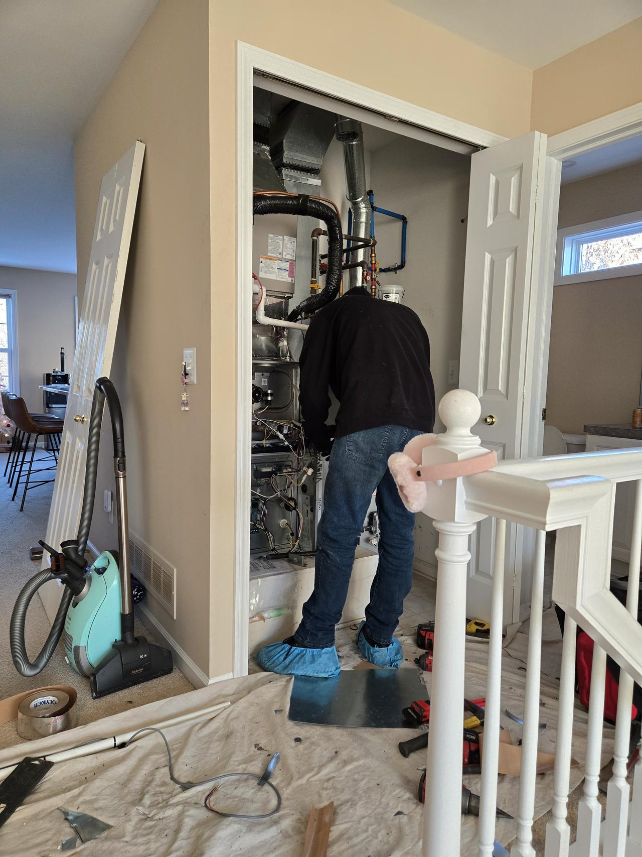 Contractor working on residential HVAC system