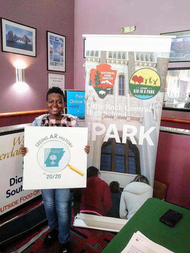 zasha hlding sign.jpg