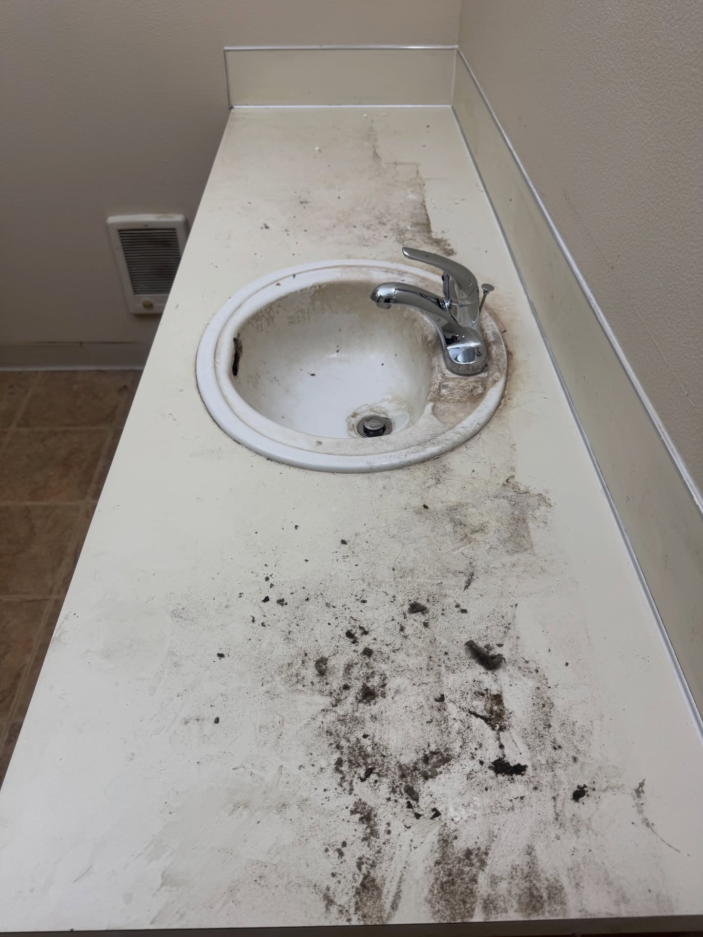 Post-construction area covered with dust and construction debris