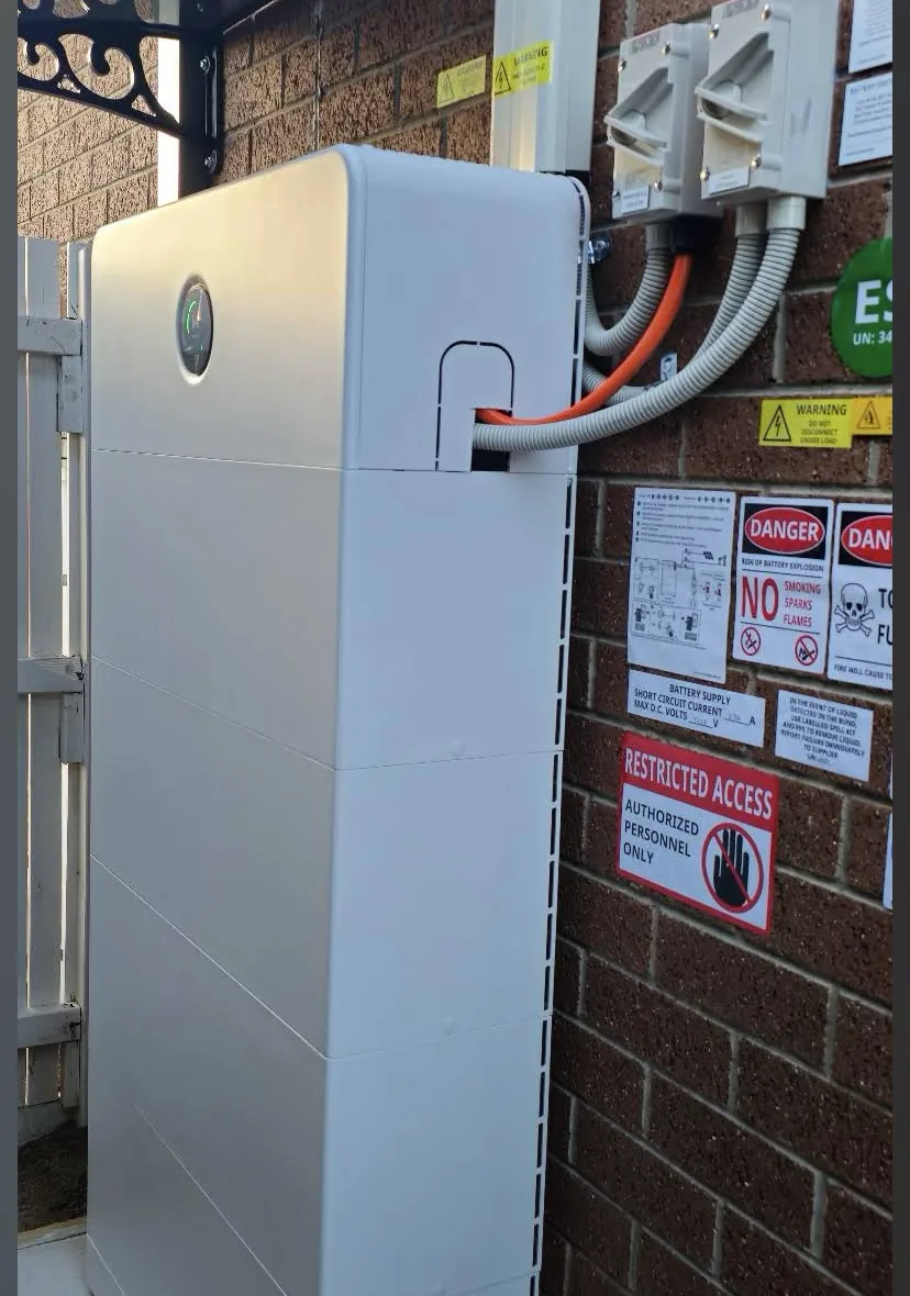 GoodWe home battery installed on a brick wall beside the inverter and isolators in Melbourne's west