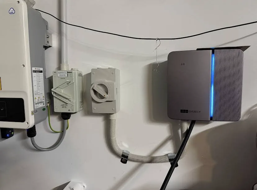 Geely EV charger installed beside a solar inverter with AC isolator