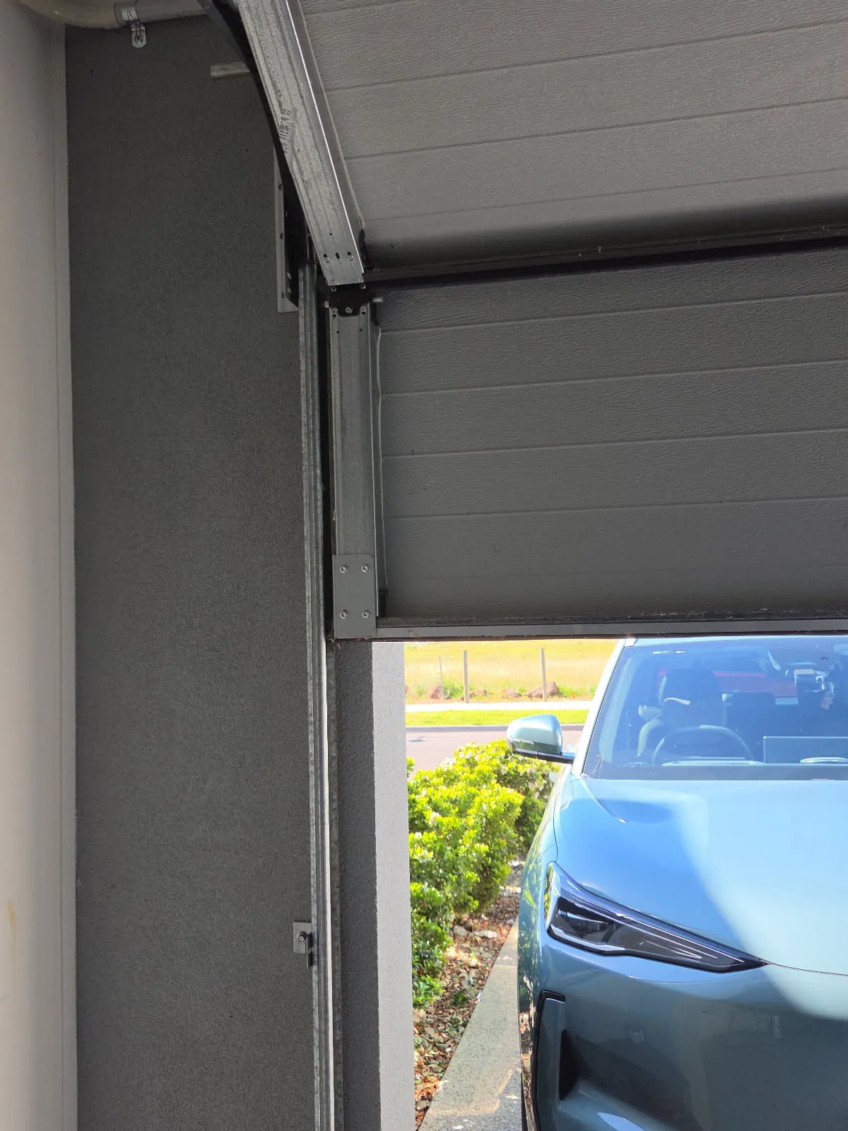 Geely EX5 parked at a Wyndham Vale townhouse ready for EV charger installation