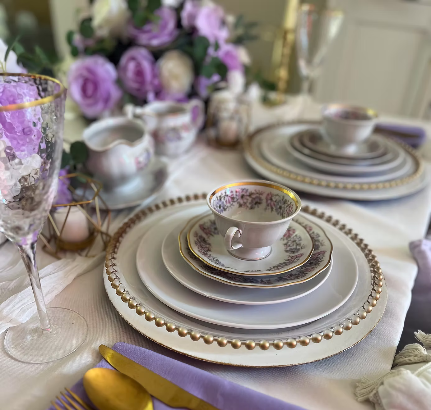 Elegant tea party setup with fine porcelain teacups and refined table setting