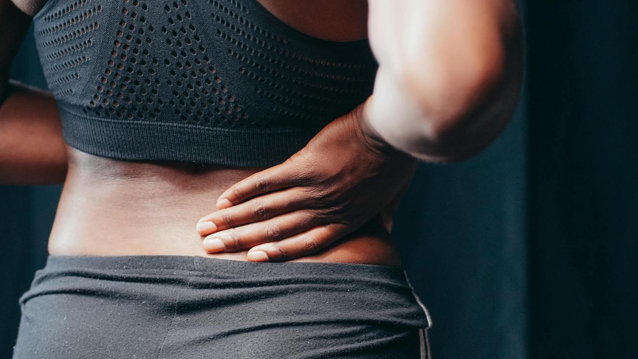 A woman in need of acupuncture for back pain