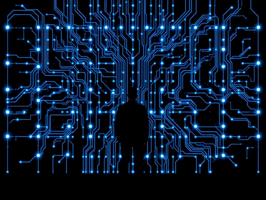 Create a realistic high-resolution photo of a human silhouette standing in front of a large, intricate control matrix composed of interconnected circuits and glowing nodes. The silhouette should be facing the matrix, suggesting contemplation and curiosity. The background should be dark to highlight the bright blue (rgb(3, 125, 201)) circuits of the matrix, with clean lines and a minimalistic composition, emphasizing the interplay between humanity and technology.