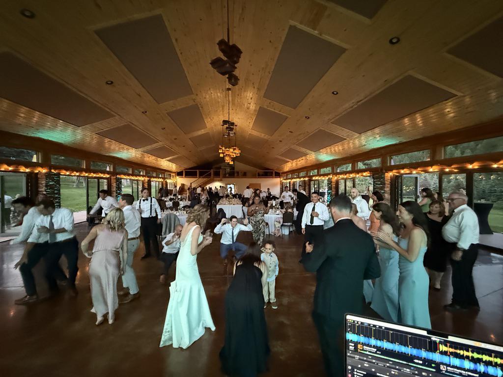 Bride and groom sharing their first dance at a Colorado mountain wedding reception.