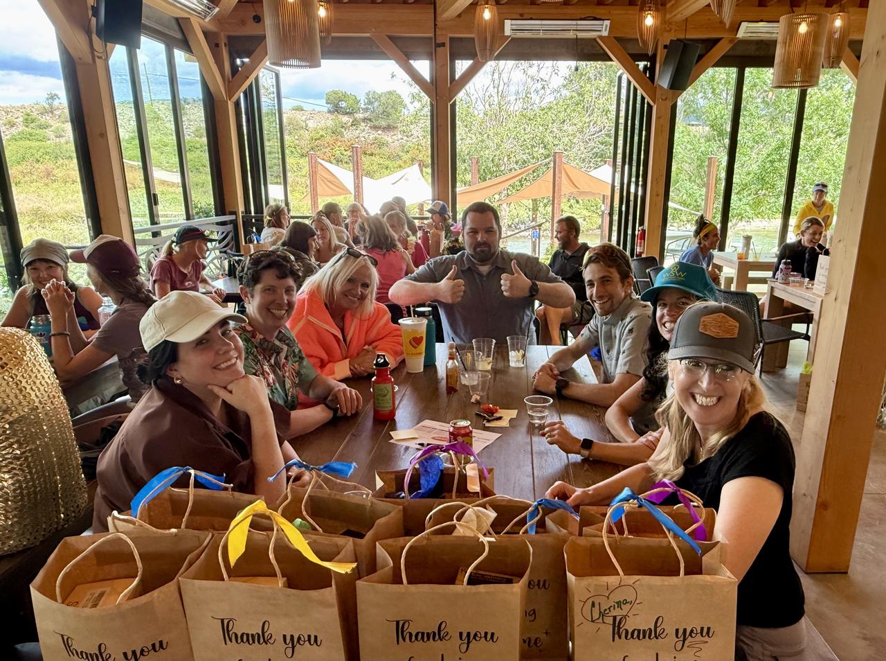 Guests enjoying a company party with dinner and conversation at a Colorado event venue.
