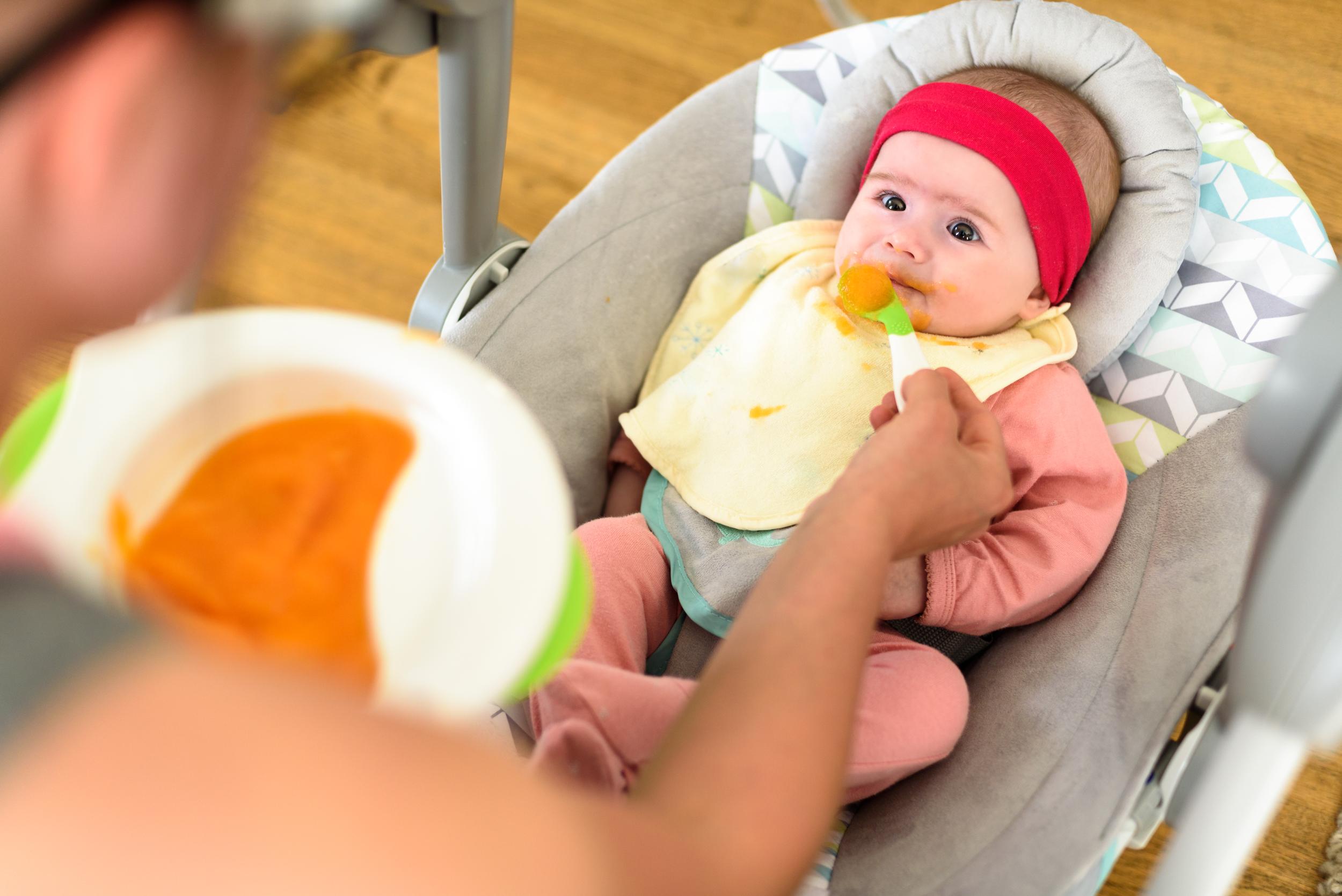 Baby being fed