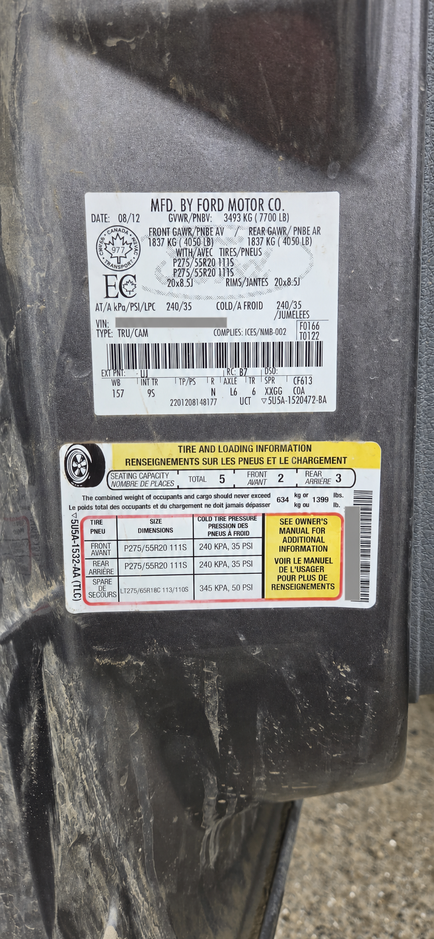 Vehicle information labels with public VIN text redacted
