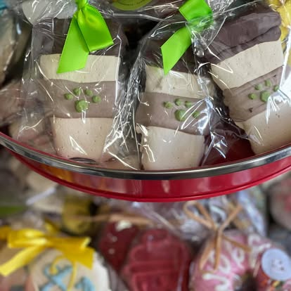 Wrapped handmade pet treats arranged in a glass dish