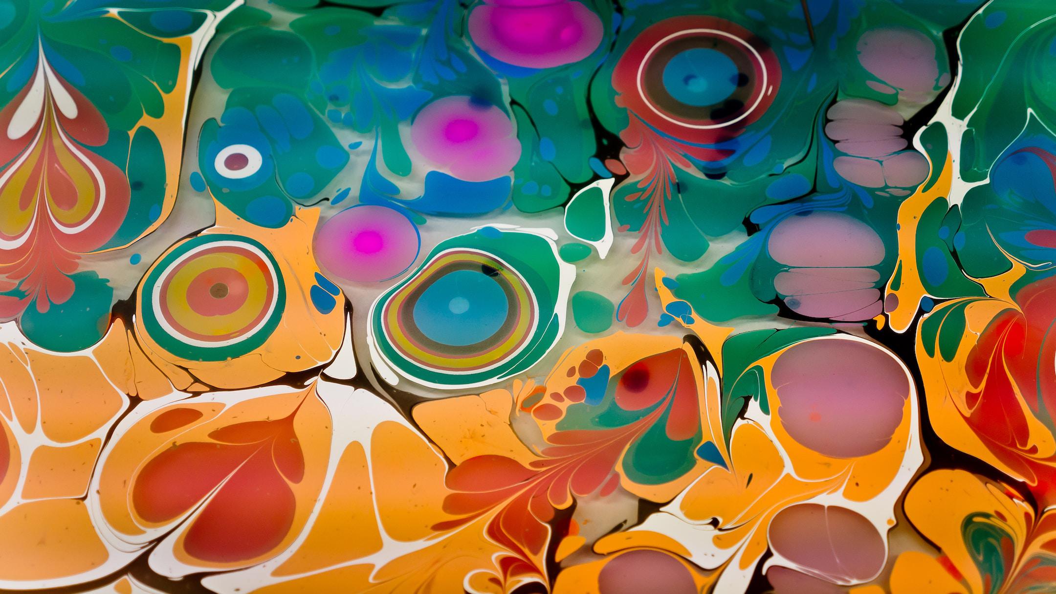 Ebru art marbling color background. Marbling, multi-colored swirled, stone-like patterns. Paint floating, spreading on the surface of a liquid. Abstract fluid art, ink in motion. Magical marble texture. Ink bloom, blast, paint explosion