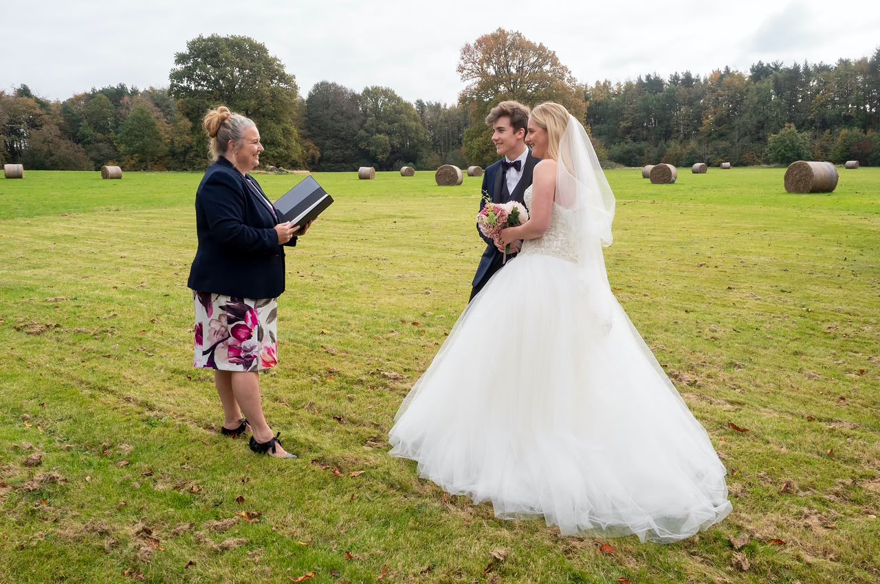 Celebrant-led wedding ceremony in an open field