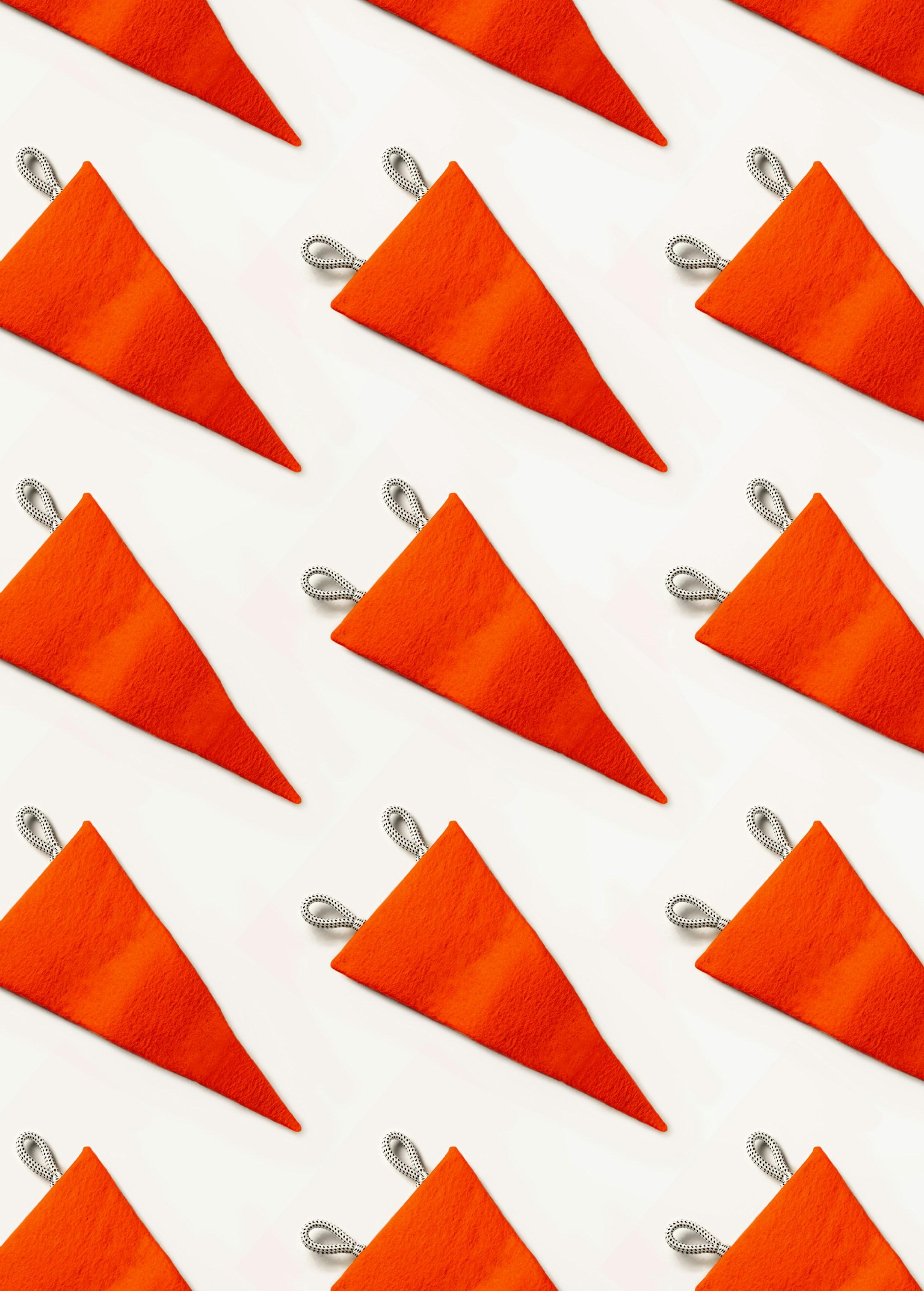 Red flags pattern on white background