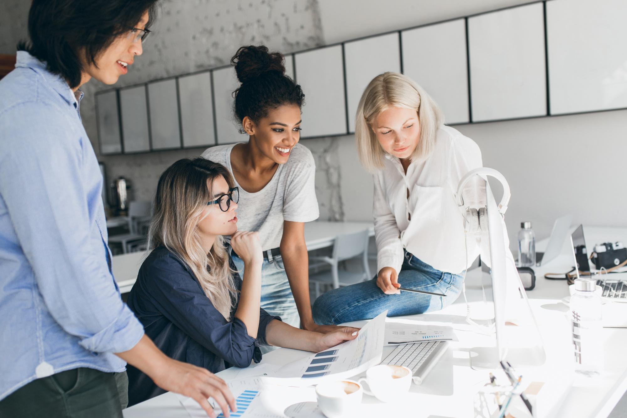african-european-girls-looking-computer-screen-while-blonde-lady-reading-documents-indoor-portrait-asian-student-glasses-talking-with-female-friends-uniersity.jpg