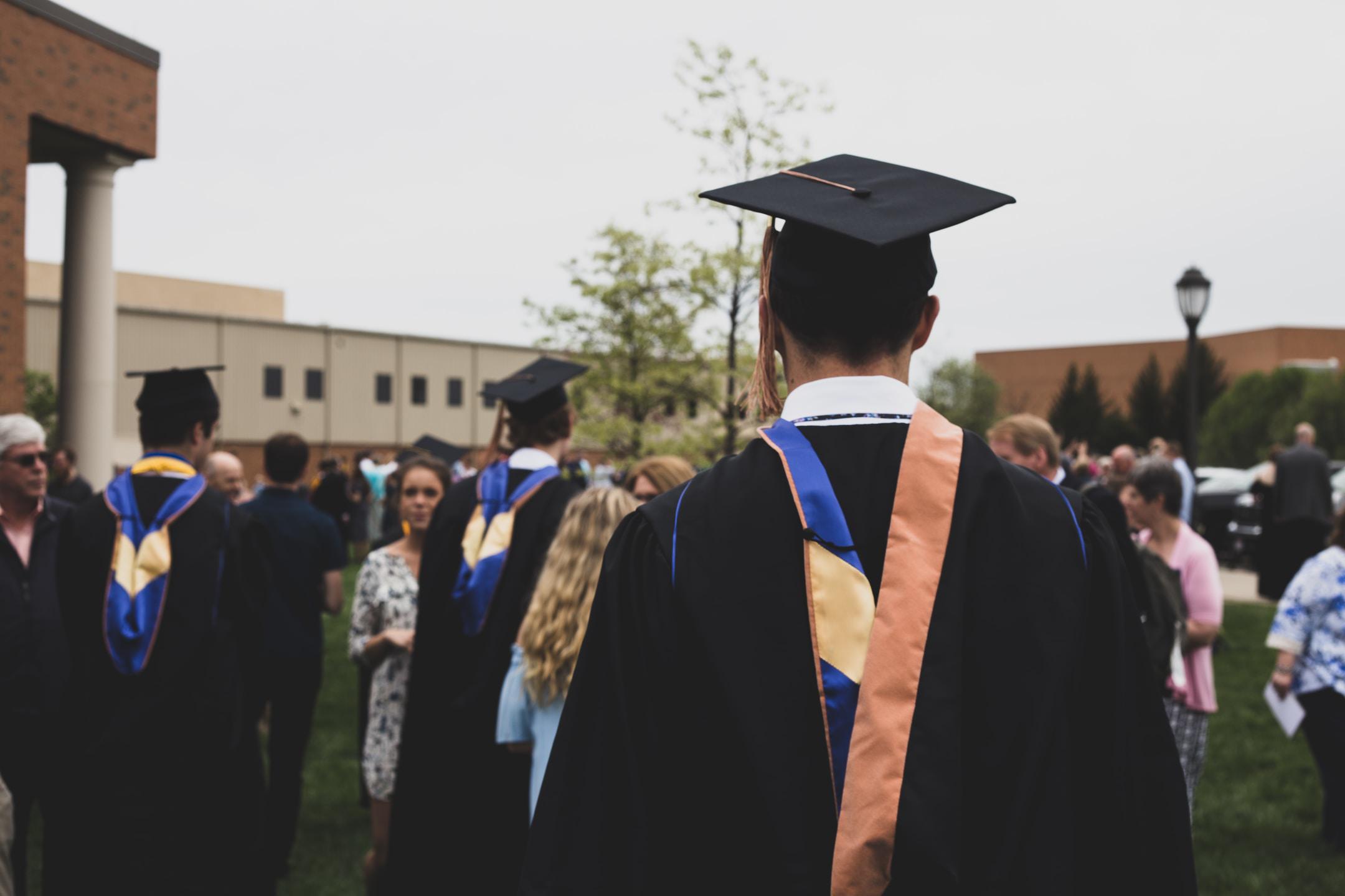 Students in caps and gowns for graduation.