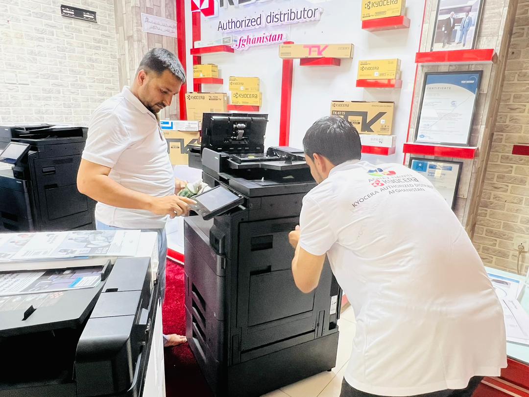 Expert technician installing office equipment