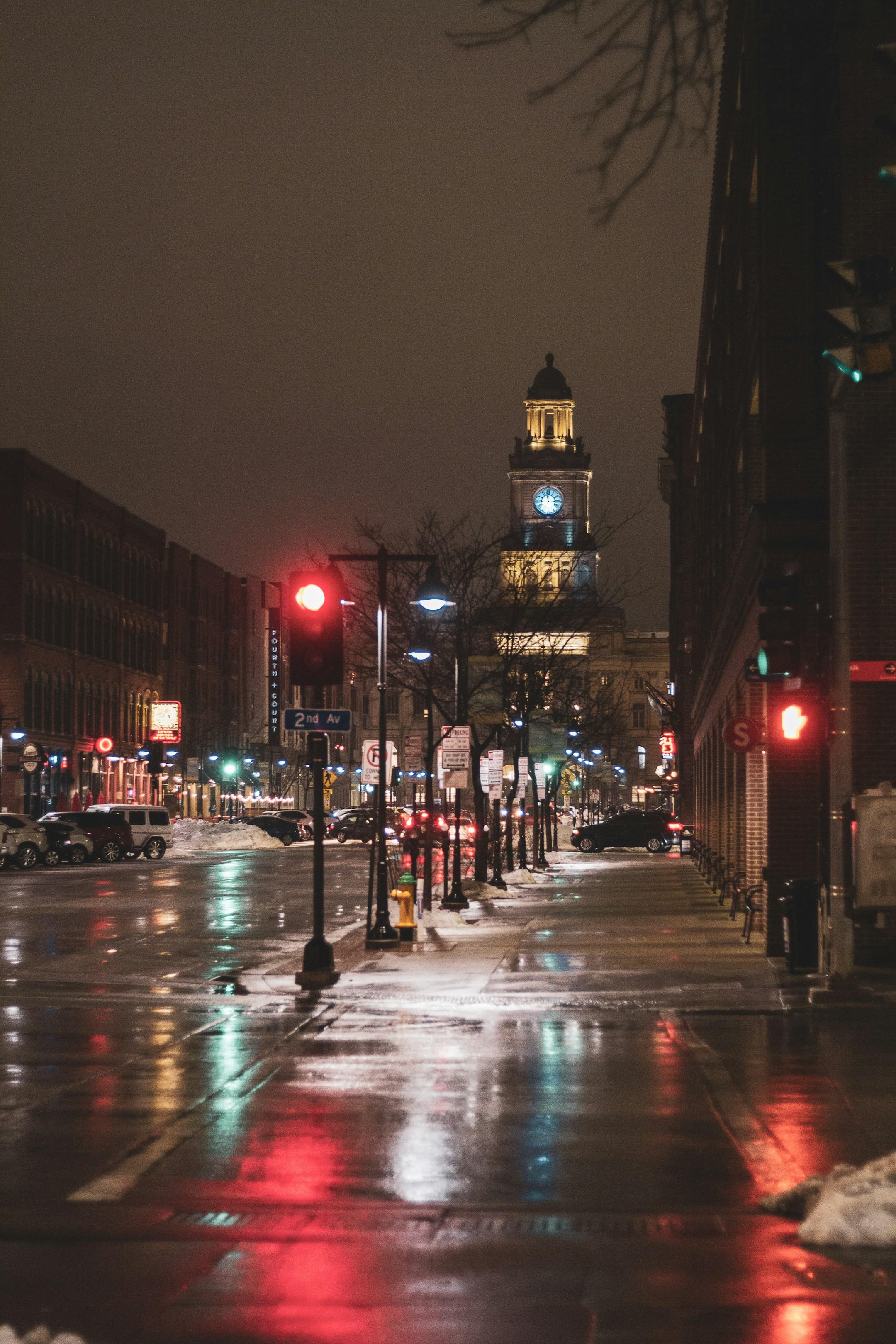 a walk down Court Ave at night, full of reflections from the street lights and buildings