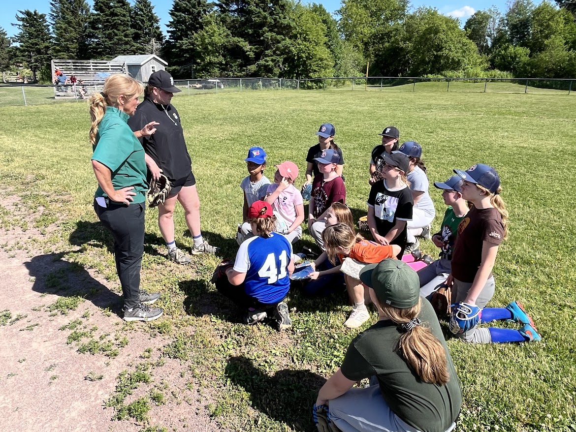 Rhonda as a sports official and leader mentoring young athletes