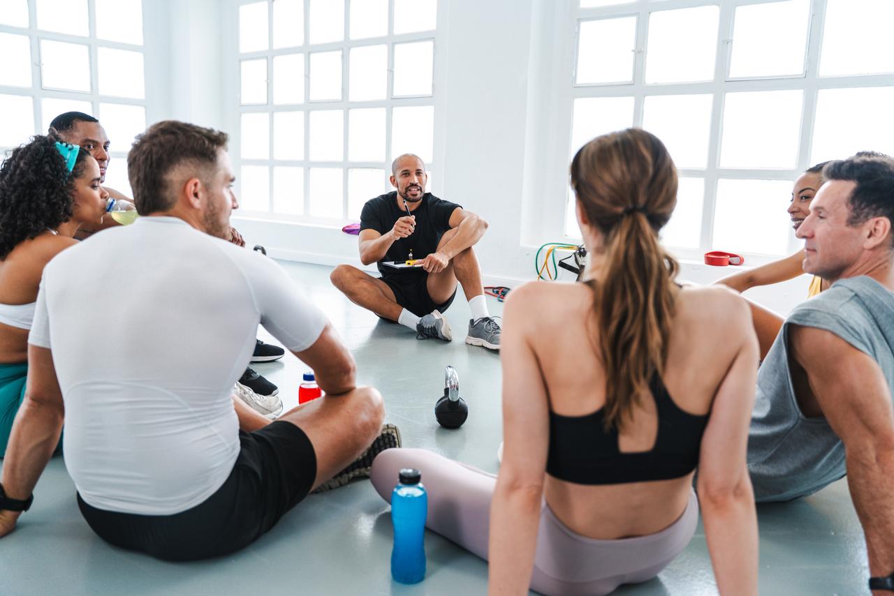 fitness-trainer-leading-discussion-with-group-afte-2026-01-09-11-59-47-utc.jpg
