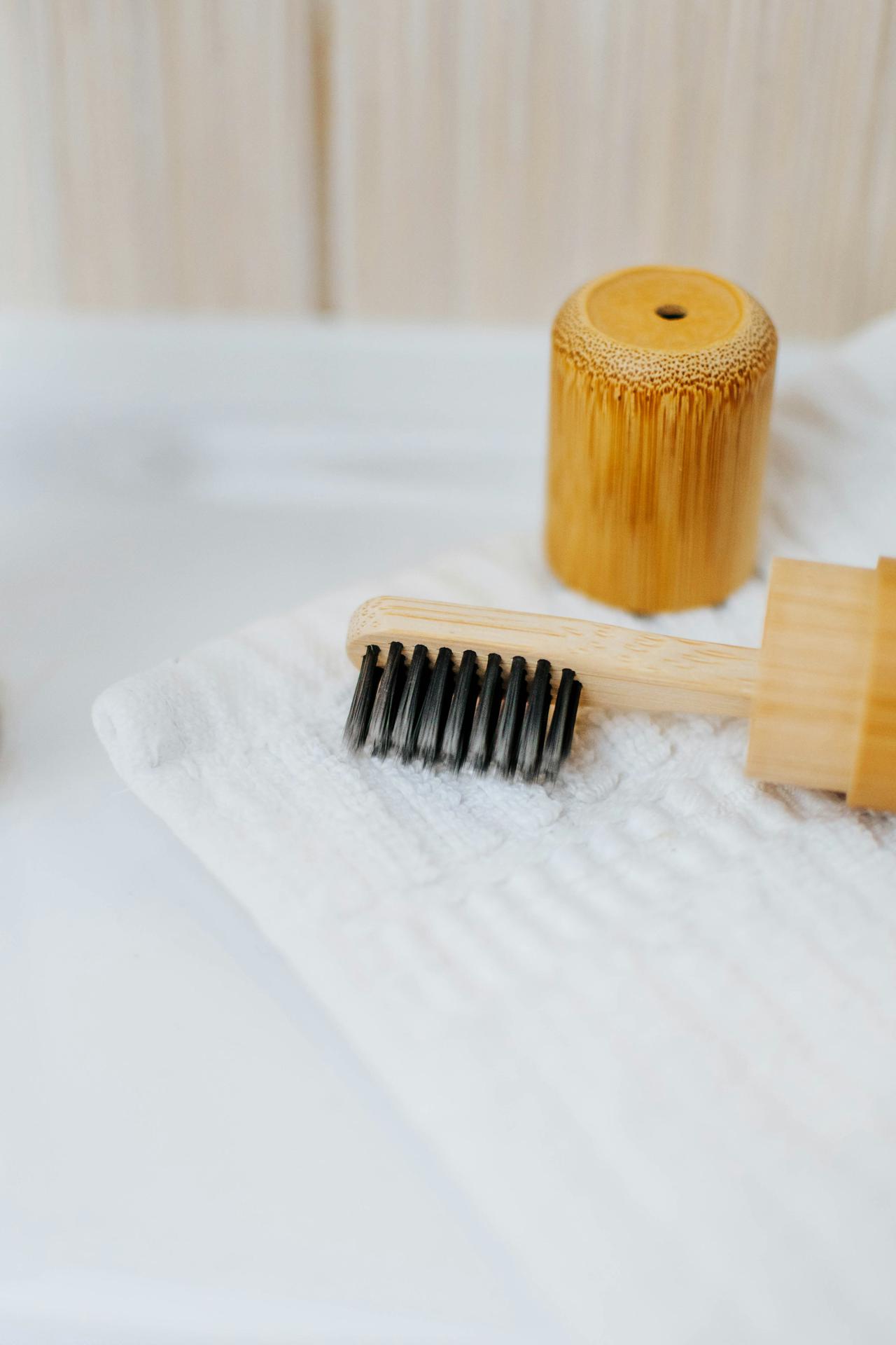 A closeup of an eco charcoal toothbrush