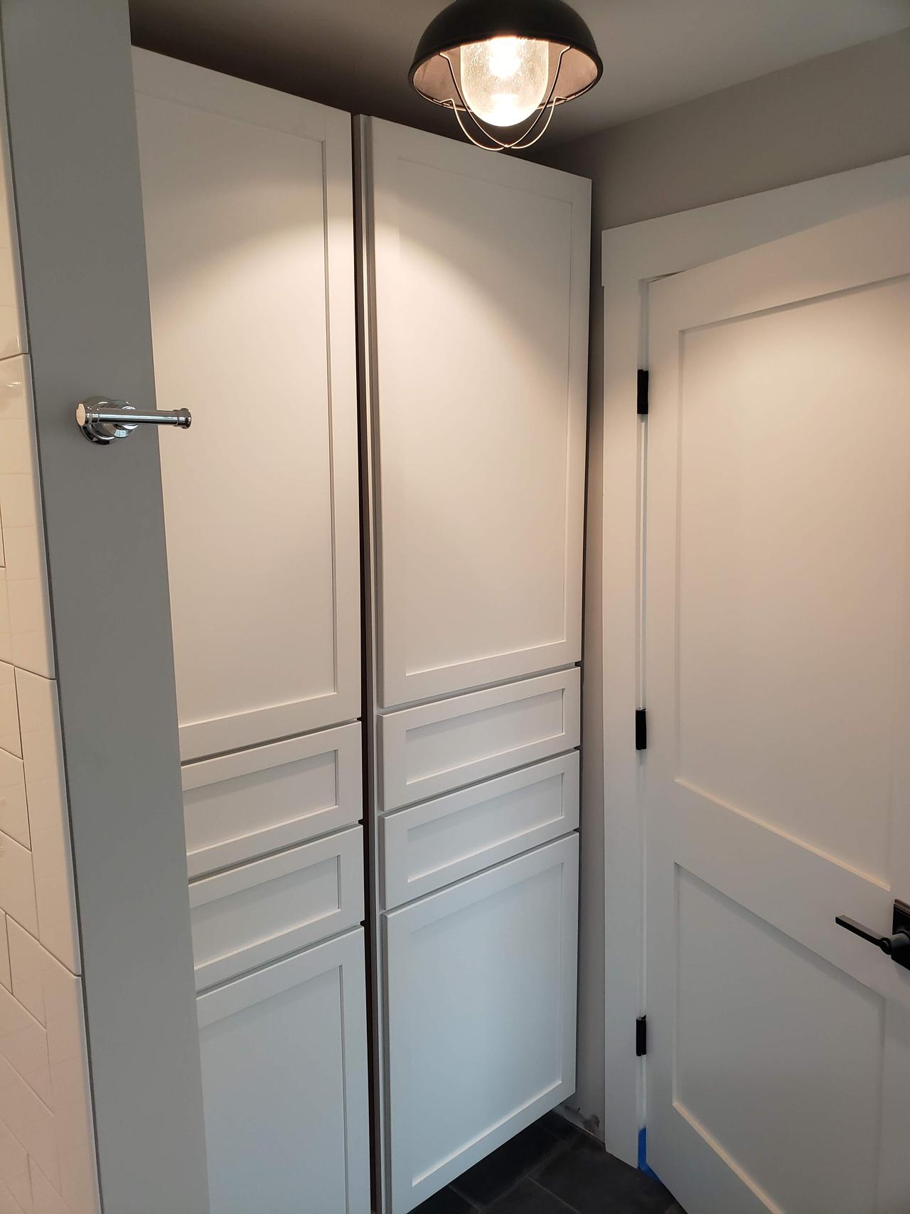 white-double-bathroom-cabinet-and-main-door