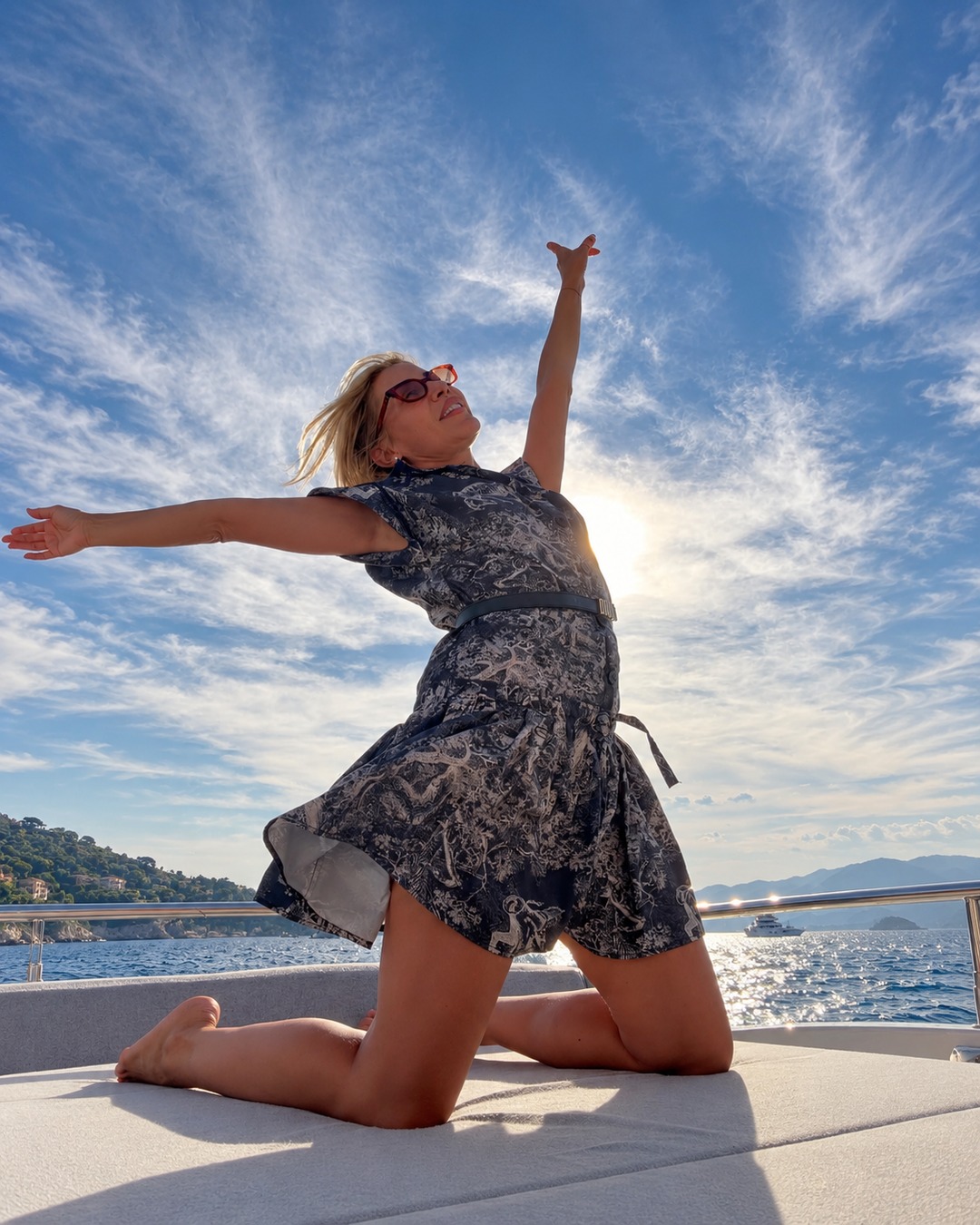 Sylwia Kaminska enjoying the Mediterranean aboard a luxury yacht, embodying the elegance and sophistication of French Riviera maritime experiences